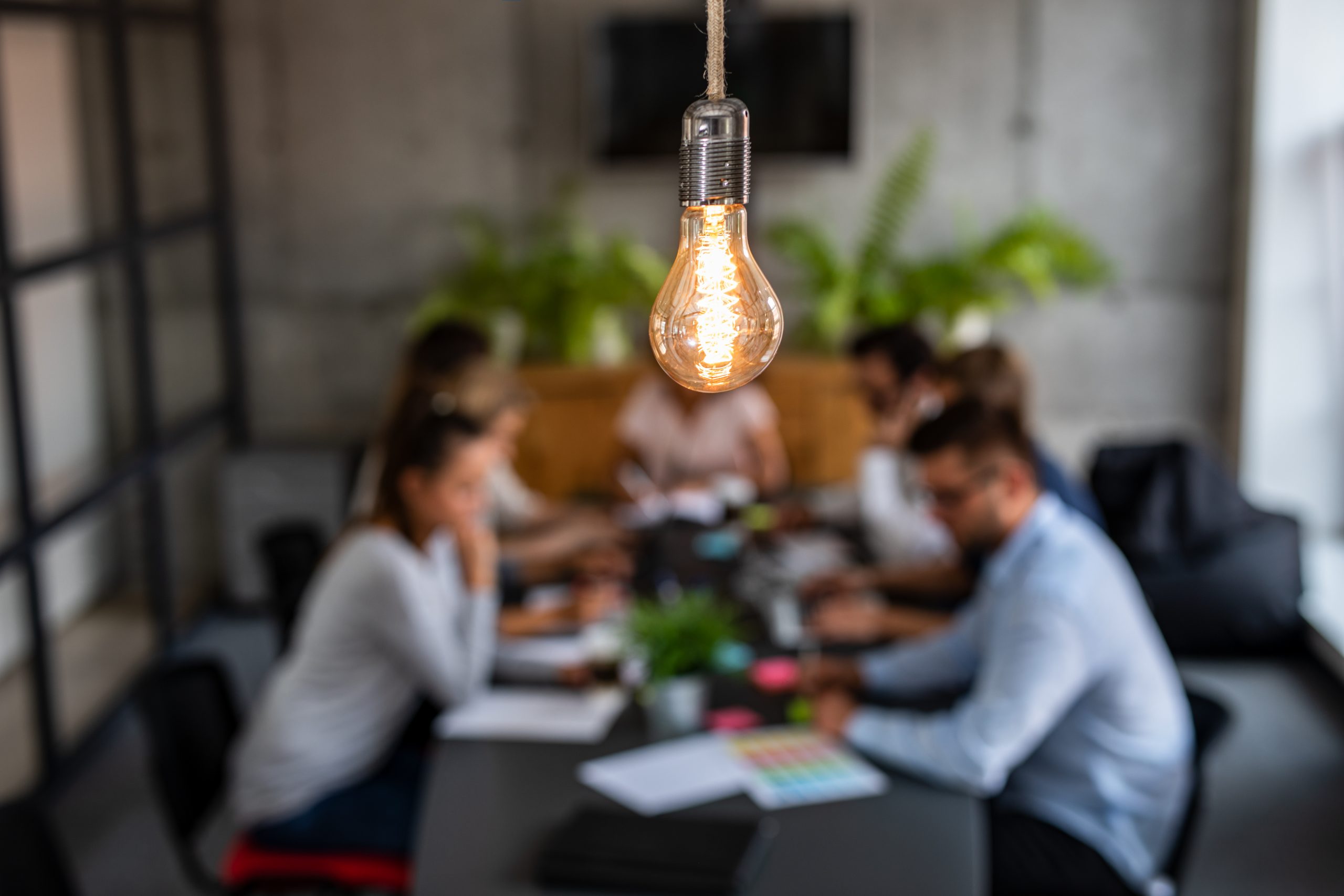 "Small Business Insurance: A Beginner's Guide" Types of insurance coverage essential for small businesses Business owners discussing small business insurance costs