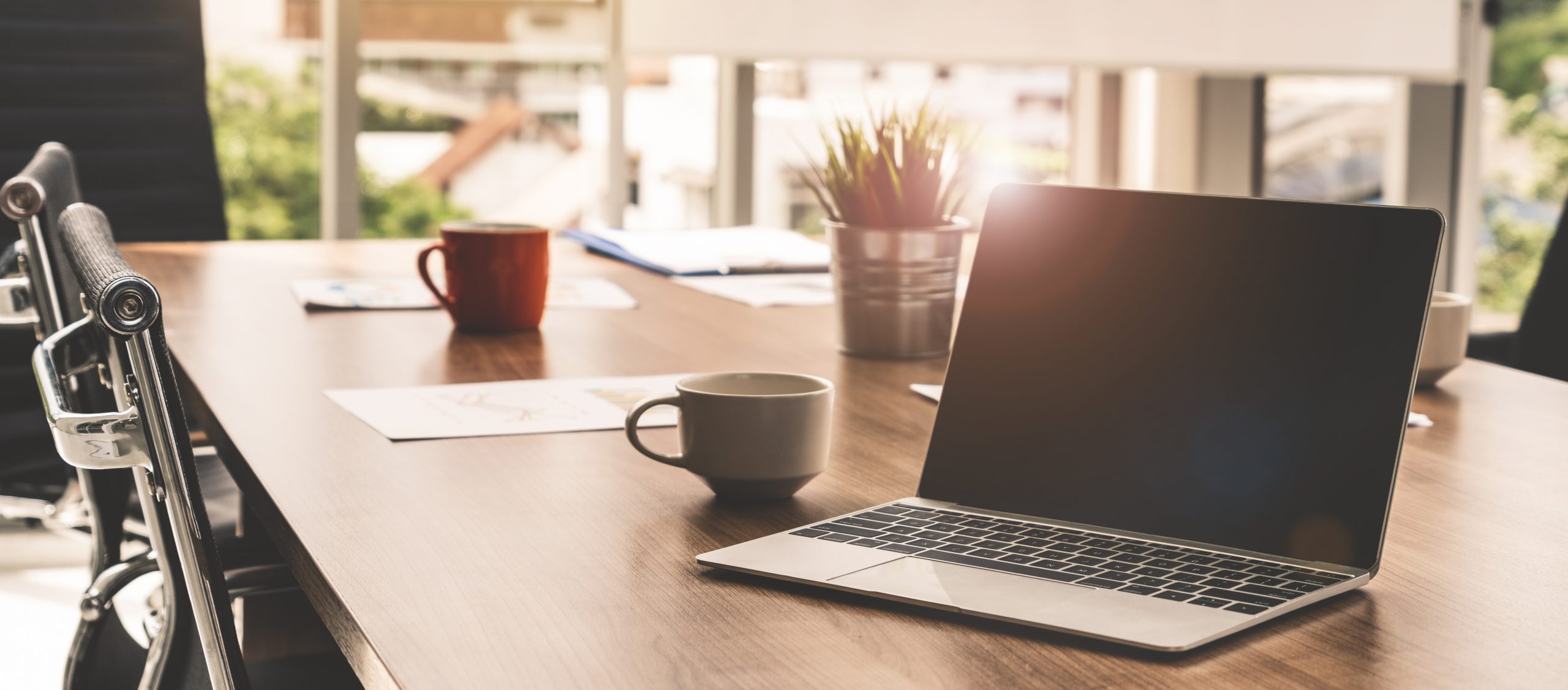 Tips for finding the right insurance provider office desk with laptop and papers displays insurance provider information