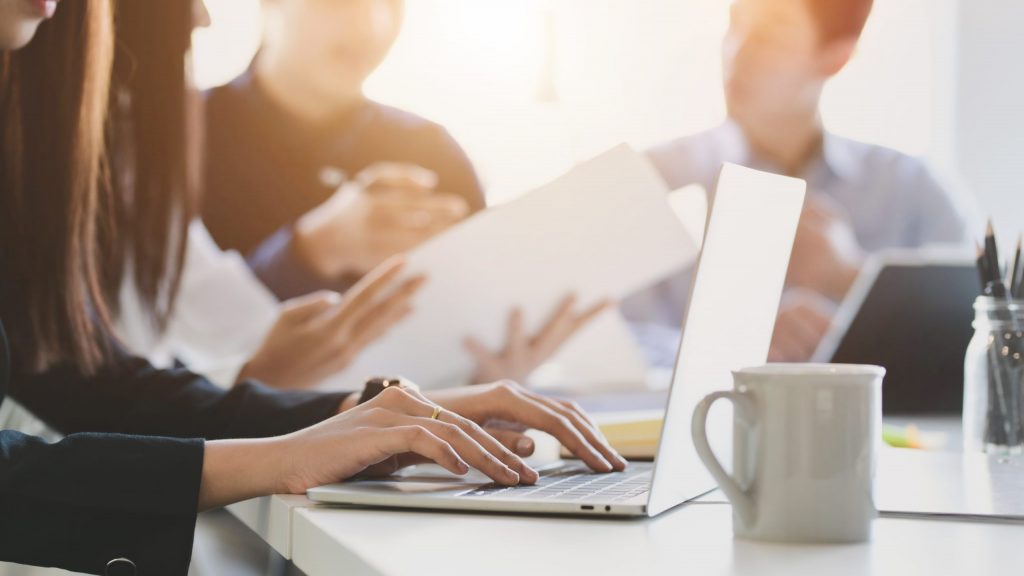 Essential Insurance Considerations for Startups Group of entrepreneurs exploring business insurance plans