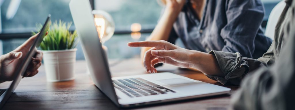 How to assess your business insurance needs three business professionals strategize their business insurance coverage.